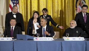 Seated from left, Chinese President Xi Jinping, President Barack Obama, and India's Prime Minister Narendra Modi, gather for a working dinner with heads of delegations of the Nuclear Security Summit in the East Room of the White House, in Washington, Thursday, March 31, 2016.