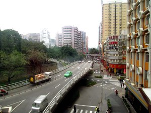 Traffic runs smoothly on this highway between commercial and hotel buildings in Macau, China.