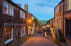 Street in the historic village of Haworth in West Yorkshire in the evening.