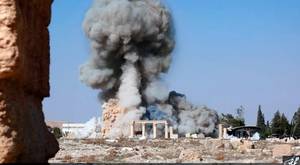 Smoke from the detonation of the 2,000-year-old temple of Baalshamin in Syria's ancient caravan city of Palmyra. Photo released Aug. 25, 2015 (Islamic State social media account via AP)