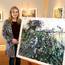 Emma Spence with one of her paintings inspired by the landscape of her Magheraconluce home