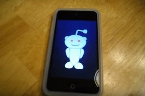 Reddit logo on a screen of a mobile phone.