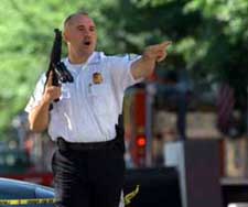 Secret Service with automatic weapons directing people away from the White House.