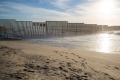 An existing fence bordering the US and Mexico. 