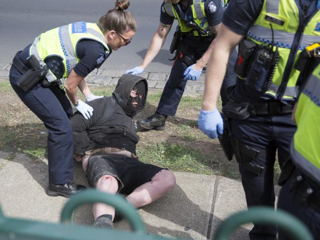 An image taken during a clash between two protest groups outside an Halal Expo in Flemington. Photo: Erik Anderson.