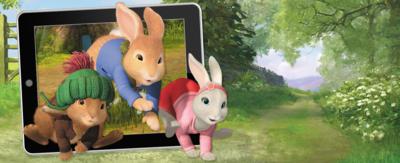 Peter Rabbit, Benjamin Bunny and Lily hopping in front of a tablet device