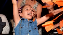 Suri Cruise (L) and actress Katie Holmes in the audience during Nickelodeon's 28th Annual Kids' Choice Awards.