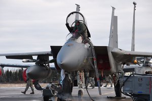 File - U.S. Airmen from the 144th Fighter Wing prepare a United States Air Force F-15C Eagle for the first mission at 5 Wing Goose Bay, Canada, Oct. 19, 2015.