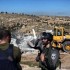 Israeli soldiers raid area with bulldozers to demolish shelters and destroy water tank.