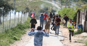 Demonstrators retreating from tear gas