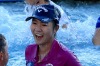 Lydia Ko with her caddie Jason Hamilton, her sister Sura Ko and her mother Tina Hyon after the leap into Poppie's Pond ...