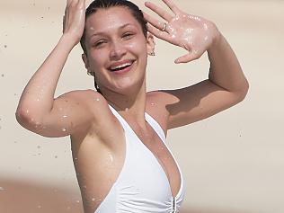 FOR DAILY TELE FEE APPLIES April 2nd 2016 St Barts Bella Hadid shows off her incredible sexy body on a white swimsuit while soaking up the sun on Caribbean holiday with friends BYLINE MUST READ Spread Pictures No Web Usage before agreement Please hide the children s faces prior to the publication Stricly No Mobile Phone Application or Apps use without our Prior Agreement Enquiries at photo spreadpictures com