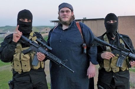 Muslim convert Abu Qatadah (centre) with body guards