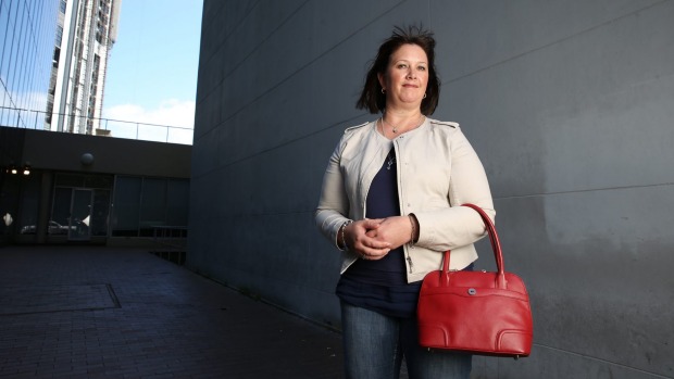 Like many women, insurance broker Carolyn Roche carries a handbag to work rather than briefcase.