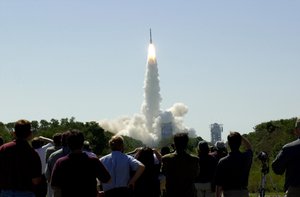 File - At 11:02 a.m. EDT on April 7, 2001, crowds watch a Boeing Delta II rocket lift off from Cape Canaveral Air Force Station, Florida, carrying NASA's 2001 Mars Odyssey spacecraft into space on its seven-month journey to Mars.