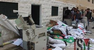 Destroyed items from the Tuesday morning raid gathered outside the rooms