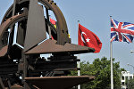 A Turkish and an Union Jack flags are pictured at the NATO Headquarters in Brussels