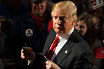 Republican presidential candidate Donald Trump signs autographs for supporters at the conclusion of a Donald Trump rally at Millington Regional Jetport on February 27, 2016 in Millington, Tennessee