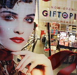 Holiday gift giving ideas are featured in a Sephora window.