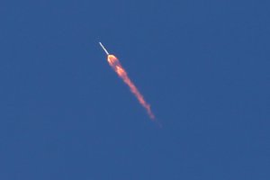 The SpaceX Falcon 9 rocket is seen from downtown Orlando as it launches from the Kennedy Space Center in Cape Canaveral, Fla., Friday, April 8, 2016.