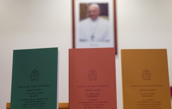 Copies of the post-synodal apostolic exhortation Amoris Laetitia ('The Joy of Love') document are on display prior to the start of a press conference at the Vatican (AP Photo/Andrew Medichini)