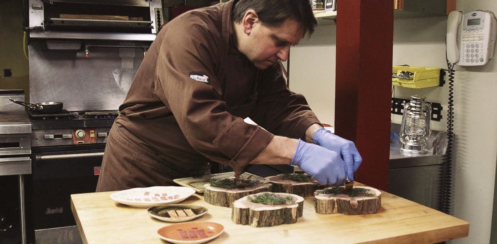 PHOTO: Damon Baehrel prepares dishes in his basement restaurant in Earlton, New York, Oct. 27, 2015.