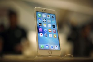 A new Apple iPhone 6S is displayed at an Apple store on Chicago's Magnificent Mile, Friday, Sept. 25, 2015, in Chicago.