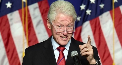 Bill Clinton says he will keep giving lucrative speeches "to pay our bills" while wife Hillary Clinton runs for the White House (AFP Photo/Frederic J. Brown)