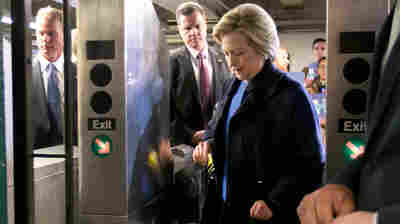 Democratic presidential candidate Hillary Clinton holds her Metrocard as she goes through the turnstile to enter the subway in the Bronx borough of New York, Thursday, April 7, 2016.