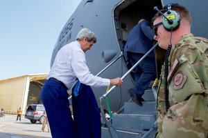 U.S. Secretary of State John Kerry boards a C-17 aircraft on April 8, 2016, for a flight from Manama International Airport in Manama, Bahrain, to Baghdad International Airport in Baghdad, Iraq.