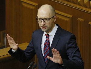 FILE - In this Tuesday, Feb. 16, 2016 file photo Ukrainian Prime Minister Arseniy Yatsenyuk speaks during an annual report in Parliament in Kiev, Ukraine.