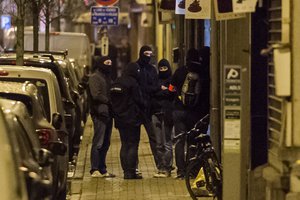 Police investigate an area where terror suspect Mohamed Abrini was arrested earlier today, in Brussels on Friday April 8, 2016.