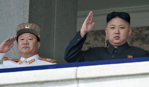 In this photo taken on April 15, 2012, North Korean leader Kim Jong Un, right, and Vice Marshal Choe Ryong Hae salute during a mass military parade in Kim Il Sung Square to celebrate the centenary of the birth of his grandfather, national founder Kim Il Sung in Pyongyang, North Korea.