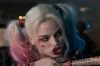 Adewale Akinnuoye-Agbaje as Killer Croc and Margot Robbie as Harley Quinn in <i>Suicide Squad</i>.