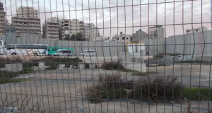 Another view of the Camp, seen through the checkpoint fence