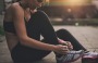 Sportswoman tying her shoelaces before the training.