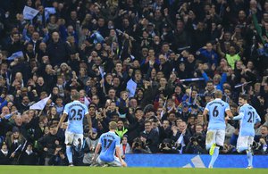 Manchester City's Kevin De Bruyne, No 17, celebrates with teammates Kevin De Bruyne, David Silva, Fernandinho, Fernando. R after scoring the opening goal of the game during the Champions League quarterfinal