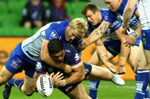 Jesse Bromwich of the Storm is tackled.