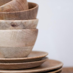Wooden Bowl - Why not have wooden dishes? They are lightweight, nearly impossible to break and add a wonderful organic warmth to the table. Plus, they would look great stacked up on open shelves!