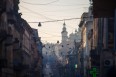Street view of Lviv in Ukraine, showing many cables across the sky between historic buildings. Image by Juanedc.com