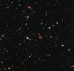 File - Peering deep into the early universe, this picturesque parallel field observation from the NASA/ESA Hubble Space Telescope reveals thousands of colorful galaxies swimming in the inky blackness of space.