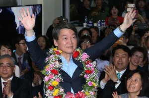 Ahn Cheol-soo, co-chairman of the opposition People's Party, celebrates his victory in the parliamentary election at his office in Seoul, South Korea, Wednesday, April 13, 2016.