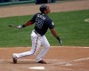 Atlanta Braves' Hector Olivera (28) bats against the New York Mets in a spring training baseball game, Saturday, March 26, 2016, in Kissimmee, Fla. (AP Photo/John Raoux)