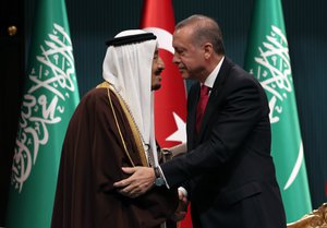 Turkish President Recep Tayyip Erdogan, right, and Saudi Arabia's King Salman embrace each other during a medal ceremony in Ankara, Turkey, Tuesday, April 12, 2016.