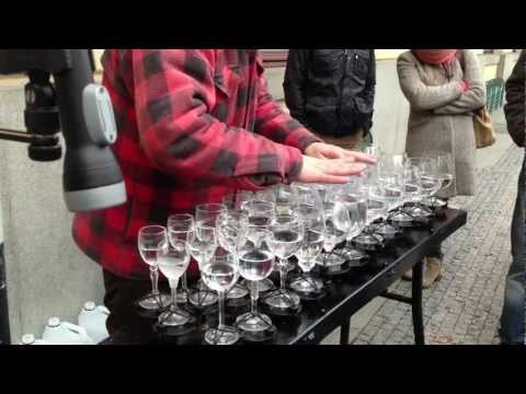 Street artist playing Hallelujah with crystal glasses