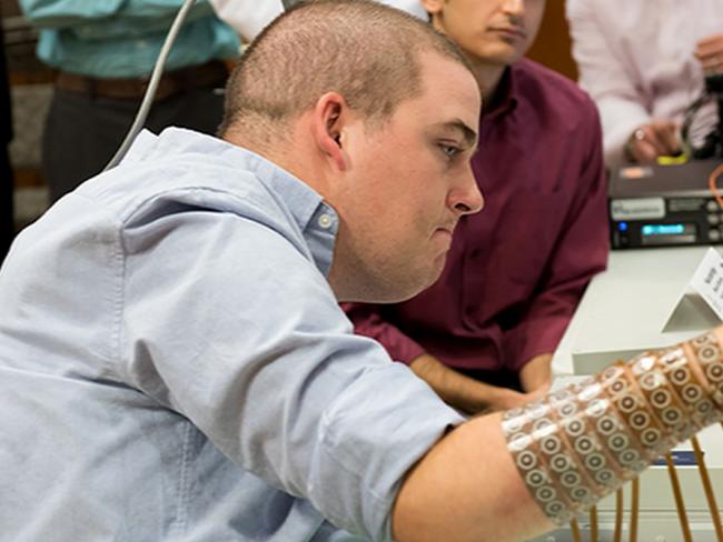 Breakthrough ... Paralysed from the chest down, Ian Bukhart has been able to use his fingers for the first time in six years after a chip was inserted in his brain. Picture: AFP/