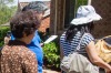 Prospective buyers wait to inspect a house.