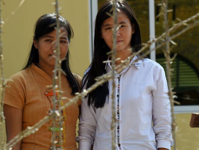 To be free ... Detained Myanmar students Honey Oo, 28, (L) graduating law student and Phyo Phyo Aung, 27, (R) third year in civil engineering, are among some 40 students under detention for protesting. Picture: AFP