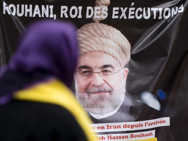 People protest against Iranian President Hassan Rohani during a demonstration denouncing Iran's use of the death penalty in Vienna in March this year.