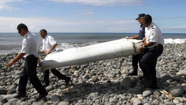 Discovery ... A flaperon found on Reunion Island last July was confirmed as from MH370. Pic: Raymond Wae Tion/EPA